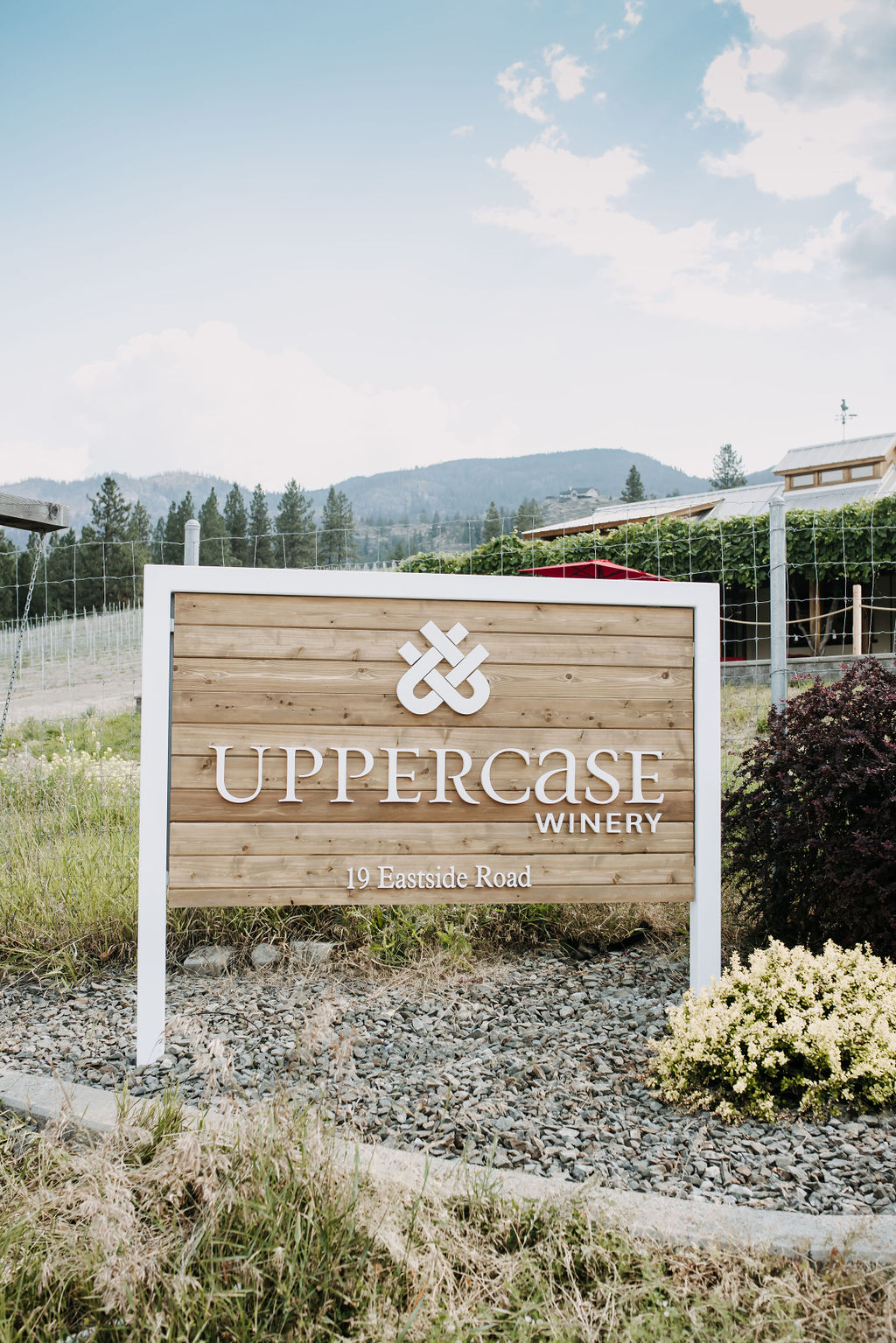 uppercase sign against mountain in background